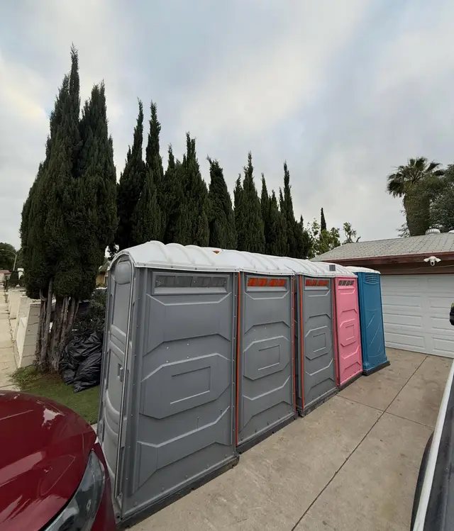 Portable toilets placed along a residential driveway